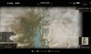 Mapa świata Wiedźmin 3. Widoczna jest lokacja Ruined Watchtower i jezioro. Na dole menu wyboru celu podróży, gdzie można wybrać Kaer Morhen.