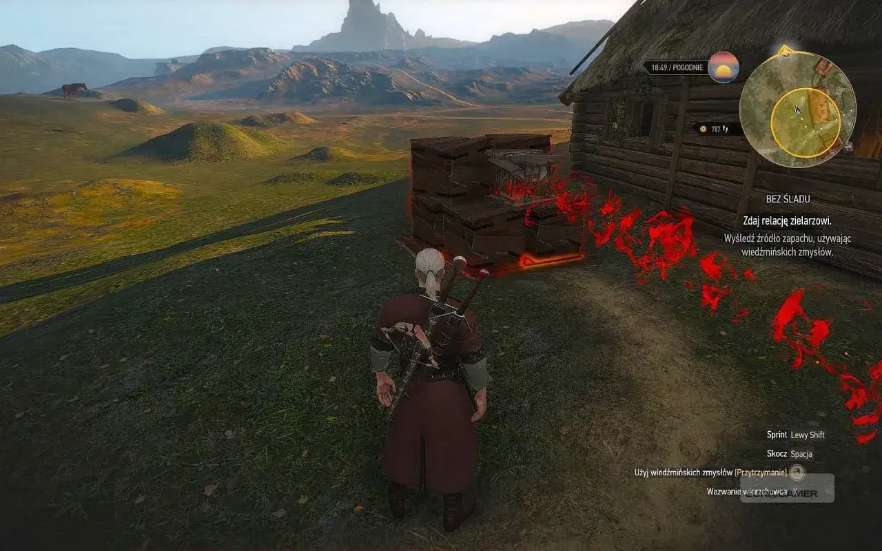 Geralt szuka śladów w Wiedźmin 3 bez śladu. Czerwone magiczne znaki wskazują drogę do źródła zapachu.