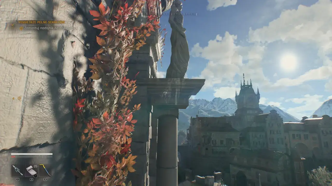 Wspinaczka w Dying Light 2, z widokiem na miasto i góry. Damien szuka sekretów.