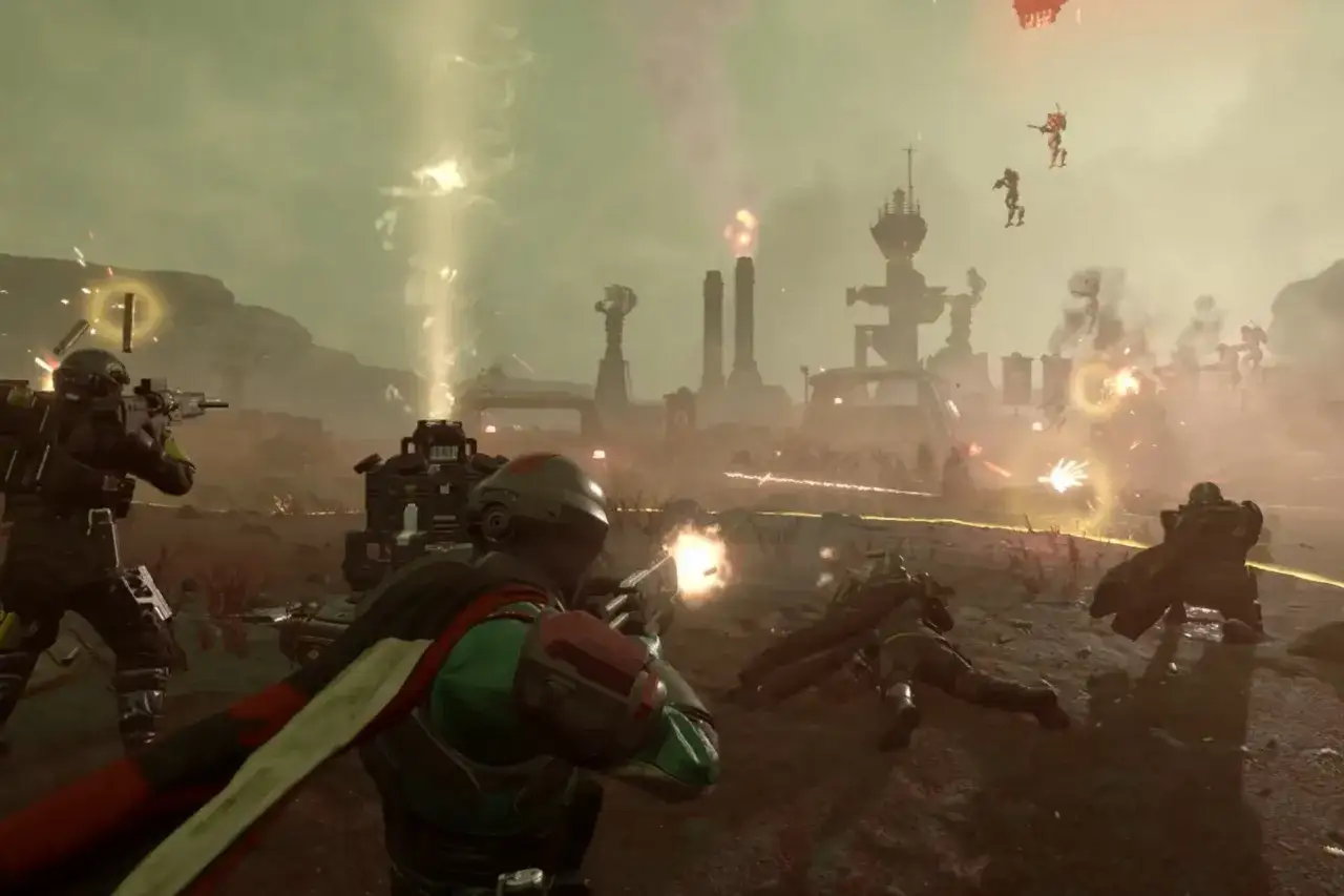 Helldivers 2 crossplay w akcji! Żołnierze walczą z wrogami na obcej planecie, otoczeni eksplozjami i dymem.