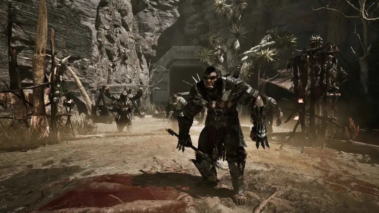 Gothic remake wymagania: groźne orki w zbrojach, wejście do jaskini, krwawe ślady na ziemi.