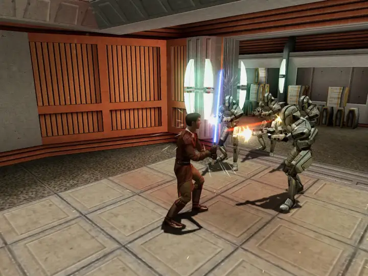 Młody Jedi walczy z droidami bojowymi w jednej z gier Star Wars.